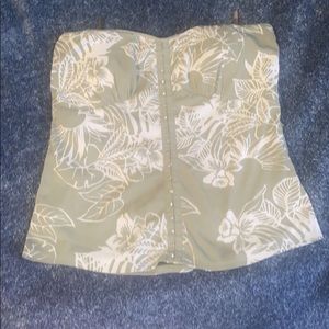 This is a strapless green floral top (clasps do not open)